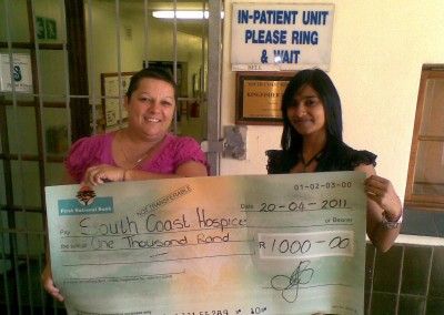 Kajal Lalmun presenting the South Coast Hospice with a donation