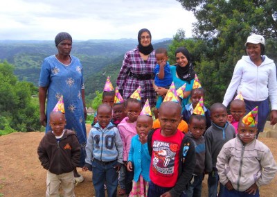 Luthfiya, Sabeehah with the staff and some of the children at the IMA Clinic