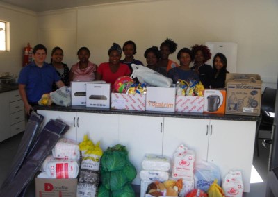 Staff from Coastal Accounting and iKhayalethu with some of the donated goods